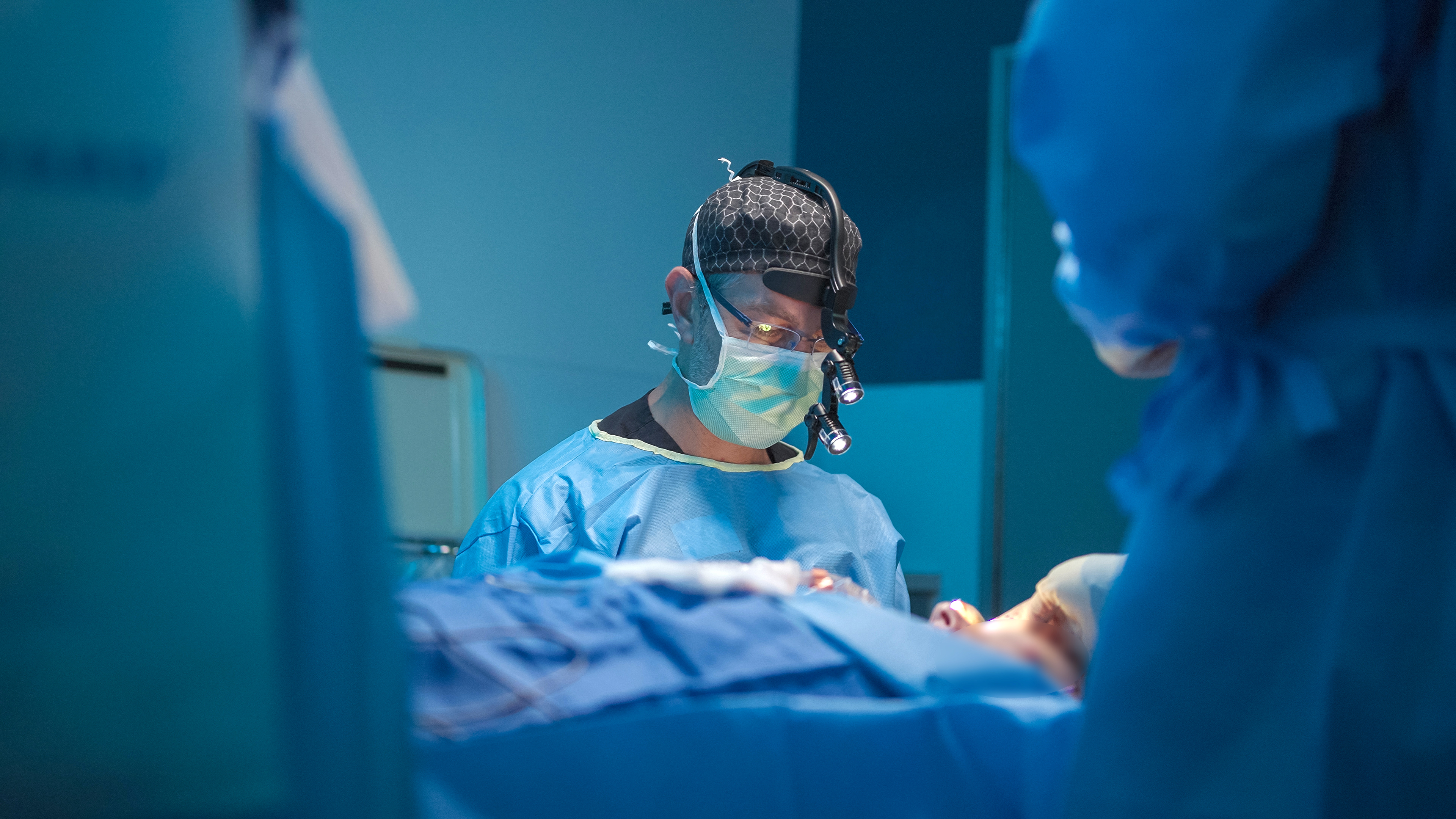 Richard V Balikian, MD FACS — Dr. Balikian in the operating room performing facial plastic surgery.