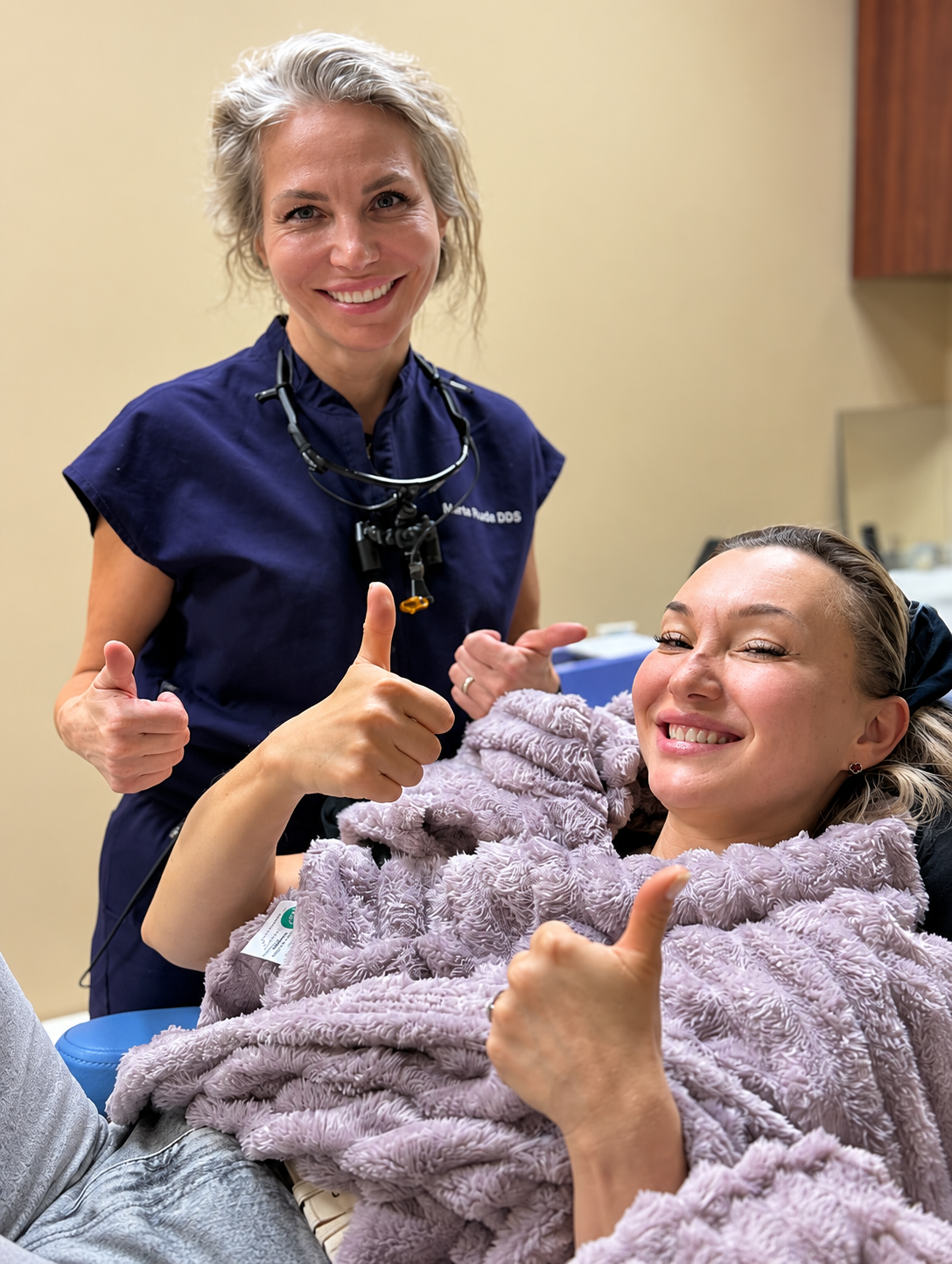 Marta Rudat DDS — A happy patient with Dr. Marta after treatment, celebrating a smile worth sharing.